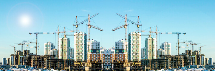 Panorama of construction at the background of blue sky