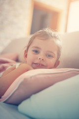 Little girl napping on couch.