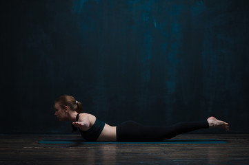 Fototapeta na wymiar Fit young woman wearing sportswear doing yoga