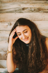 closeup portrait hipster girl with a bear toy on a wooden background