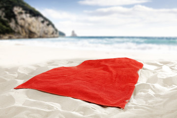 summer time and towel on sand 