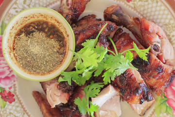Roast (grilled) chicken with steamed glutinous rice isolated on white background (selective focus)

