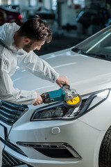 A series of detailed cars: Polishing a car