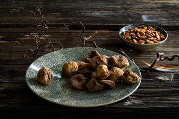 Figs in a plate on dark table