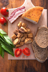 pork greaves cheease and bacon on wooden background
