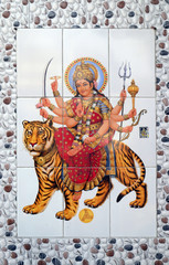 Colorful illustration of Hindu goddess Durga on the wall in Kolkata, India 