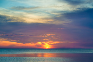 Fototapeta na wymiar beautiful sunset and beautiful cloud over sea in sunset