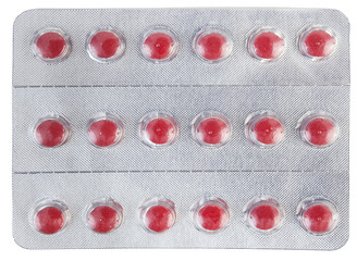 Shiny foil blister pack filled with red pills.