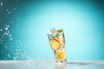 The rose exotic cocktail and fruit on blue