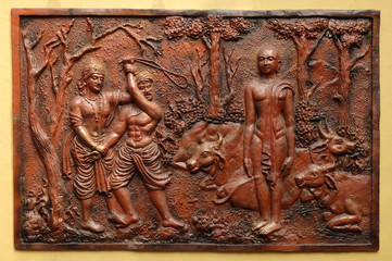 Indra prevents an ignorant cowherd from assaulting Bhagavan Mahavira, Street bass relief on the wall of Jain Temple in Kolkata