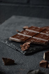 Dark photo. Dakr chocolate on the black table