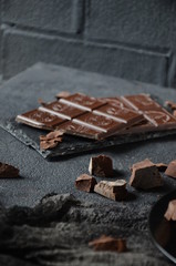 Dark photo. Dakr chocolate on the black table