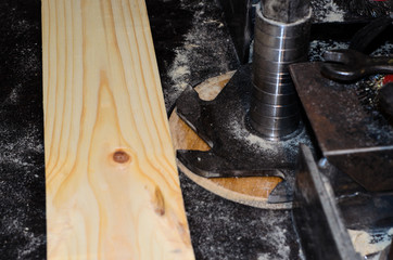 Board on a milling machine near the cutter