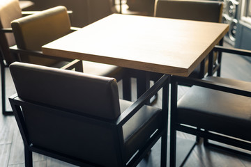 Square table and four chairs in a restaurant