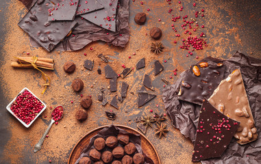 Assortment of chocolate bars, truffles, spices and cocoa powder