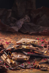 Assortment of chocolate bars, truffles, spices and cocoa powder