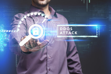 Business, Technology, Internet and network concept. Young businessman working on a virtual screen of the future and sees the inscription: Ddos attack