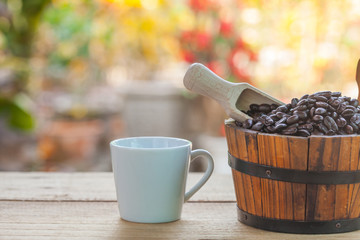 coffee bean in wood bucket and coffee cup