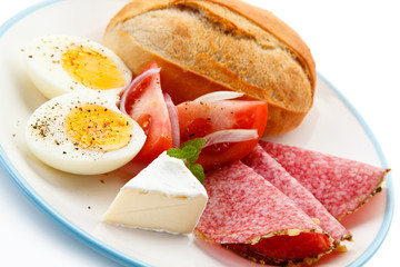 Breakfast - boiled eggs. ham and cheese sandwich