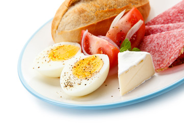 Breakfast - boiled eggs. ham and cheese sandwich