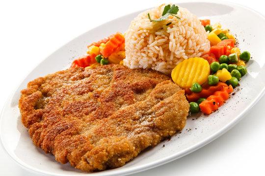 Fried pork chop with rice and vegetables