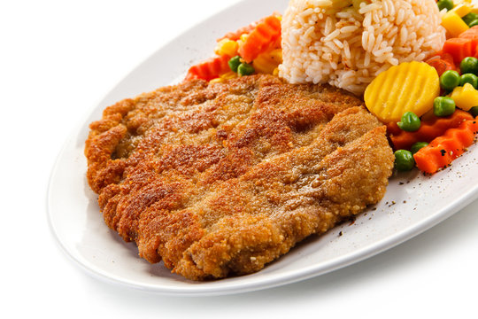 Fried pork chop with rice and vegetables