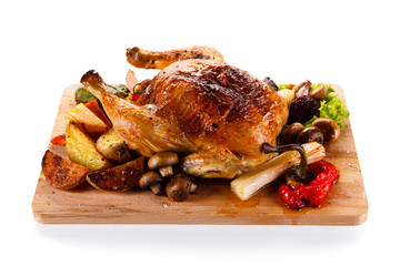 Roast chicken on cutting board