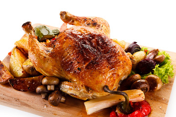 Roast chicken on cutting board