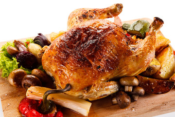 Roast chicken on cutting board
