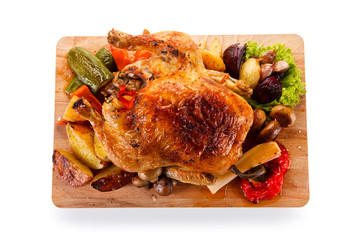Roast chicken on cutting board
