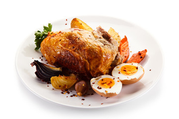 Roast chicken meat with potatoes and boiled egg