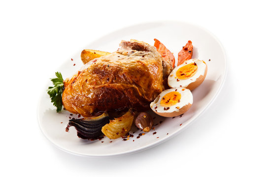 Roast chicken meat with potatoes and boiled egg