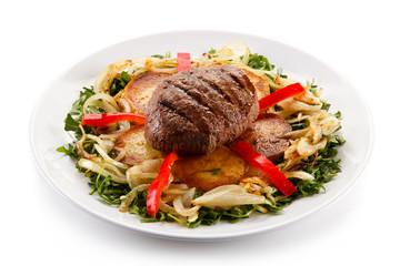 Roast steak with potatoes and vegetables