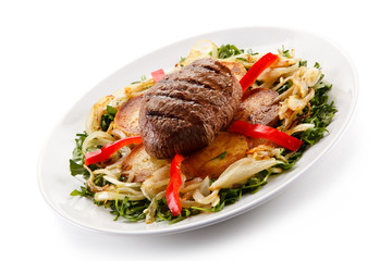 Roast steak with potatoes and vegetables
