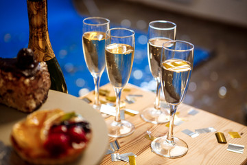 Close up photo of glasses with champagne.