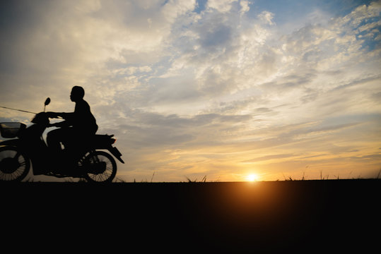 Silhouette of a man  biker motorcycle in the sunset