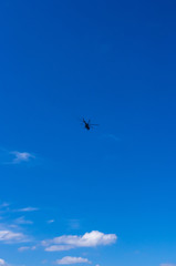 helicopter in the blue sky