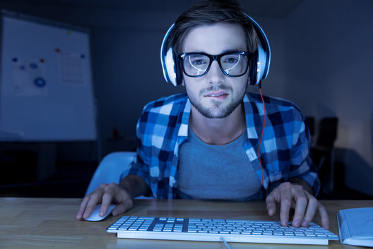 Serious nice man listening to music