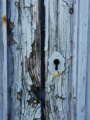 
Rusty door lock on a vintage blue wooden door