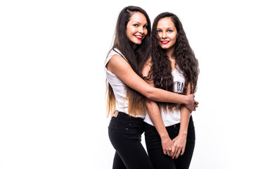 teen sisters portrait hugging each other on white background