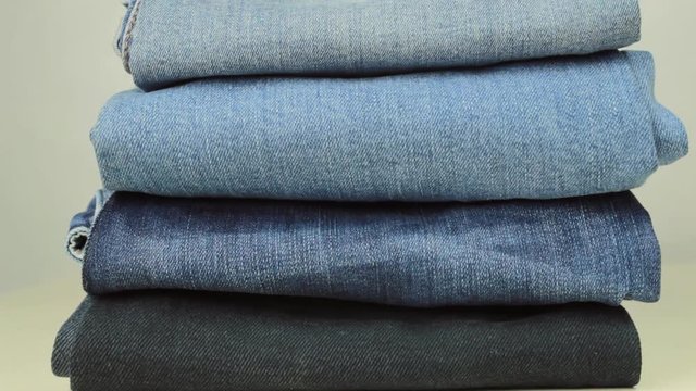Pile of blue denim jeans