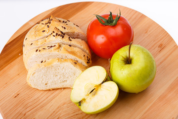 white bread with beans, tomato, Apple on a wooden tray