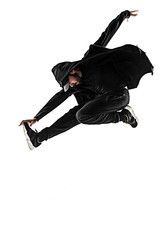 The silhouette of one hip hop male break dancer dancing on white background