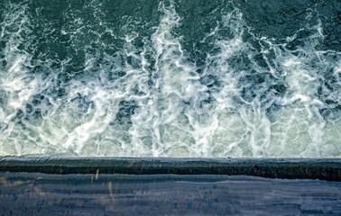 Flowing water at the weir, top view