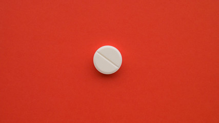 Meds pills drugs lsd extasy acid red background. Positive medicine concept. Treatment of various...