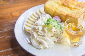 ice cream honey toast and whipped cream on the table