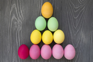 Colored painted eggs on a gray background. Easter celebrating