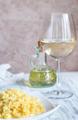 Obraz na płótnie Canvas Portion of risotto with glass of white wine