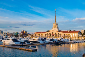Obraz premium Seaport with mooring boats at sunset in Sochi, Russia.