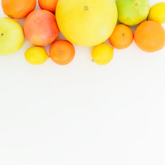 Citrus fruits on white background. Flat lay, top view. Fruit background